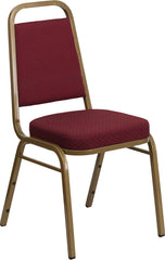 HERCULES Series Trapezoidal Back Stacking Banquet Chair with Burgundy Patterned Fabric and 2.5'' Thick Seat - Gold Frame